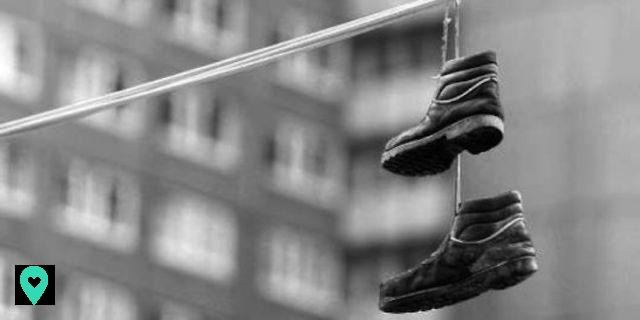 Why are there sneakers hanging over electric wires in New York?